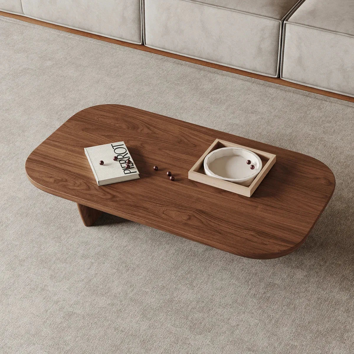 Luxury Wooden coffee table with decorative items on a gray carpet