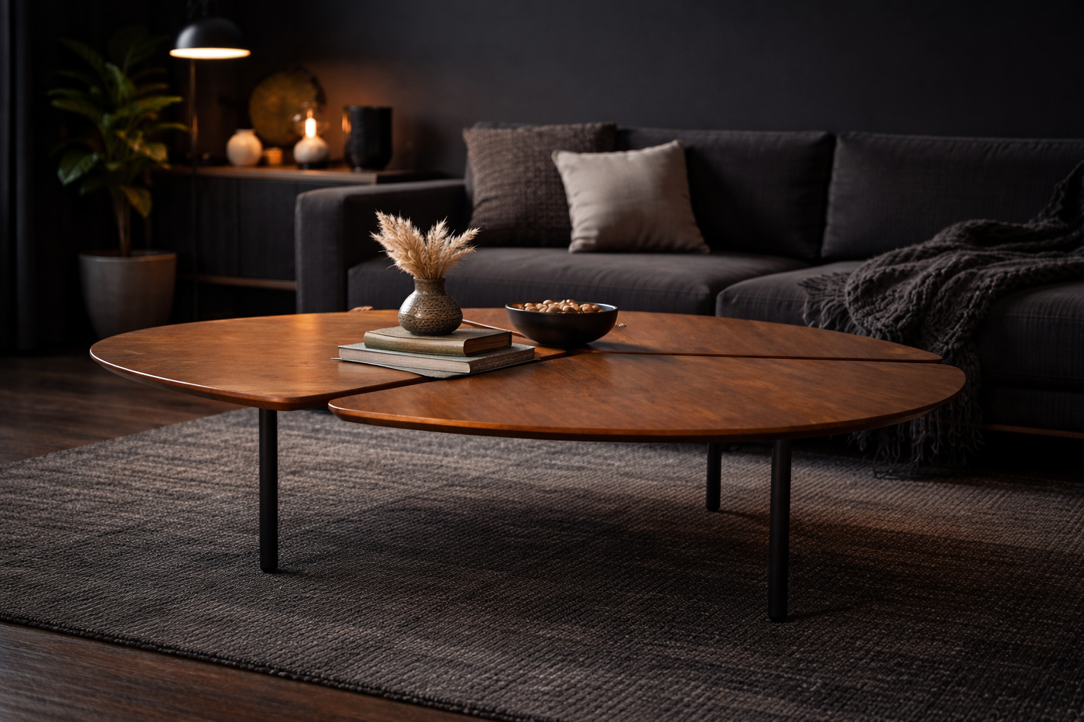 Modern living room with a dark sofa, wooden coffee table, and decorative items.