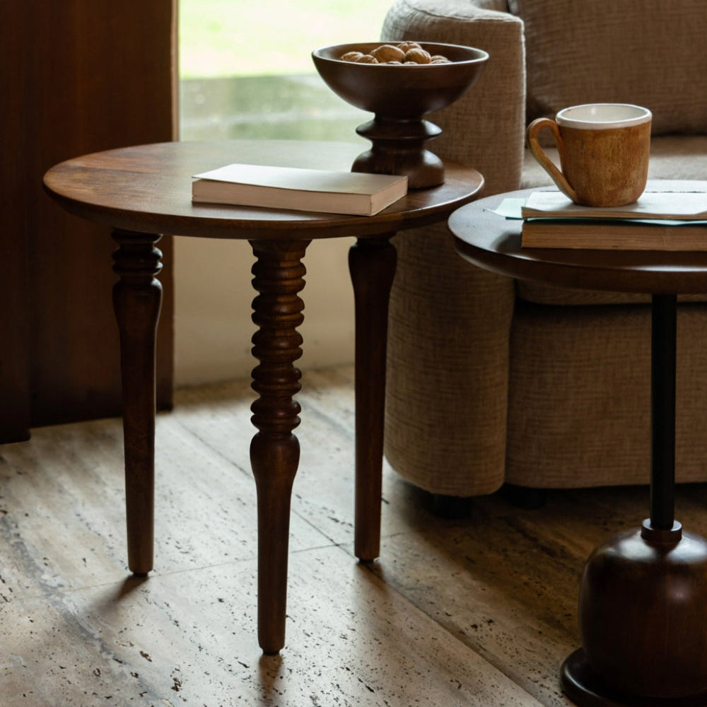 minimalist Wooden side table with a book and cup in a cozy living room setting.