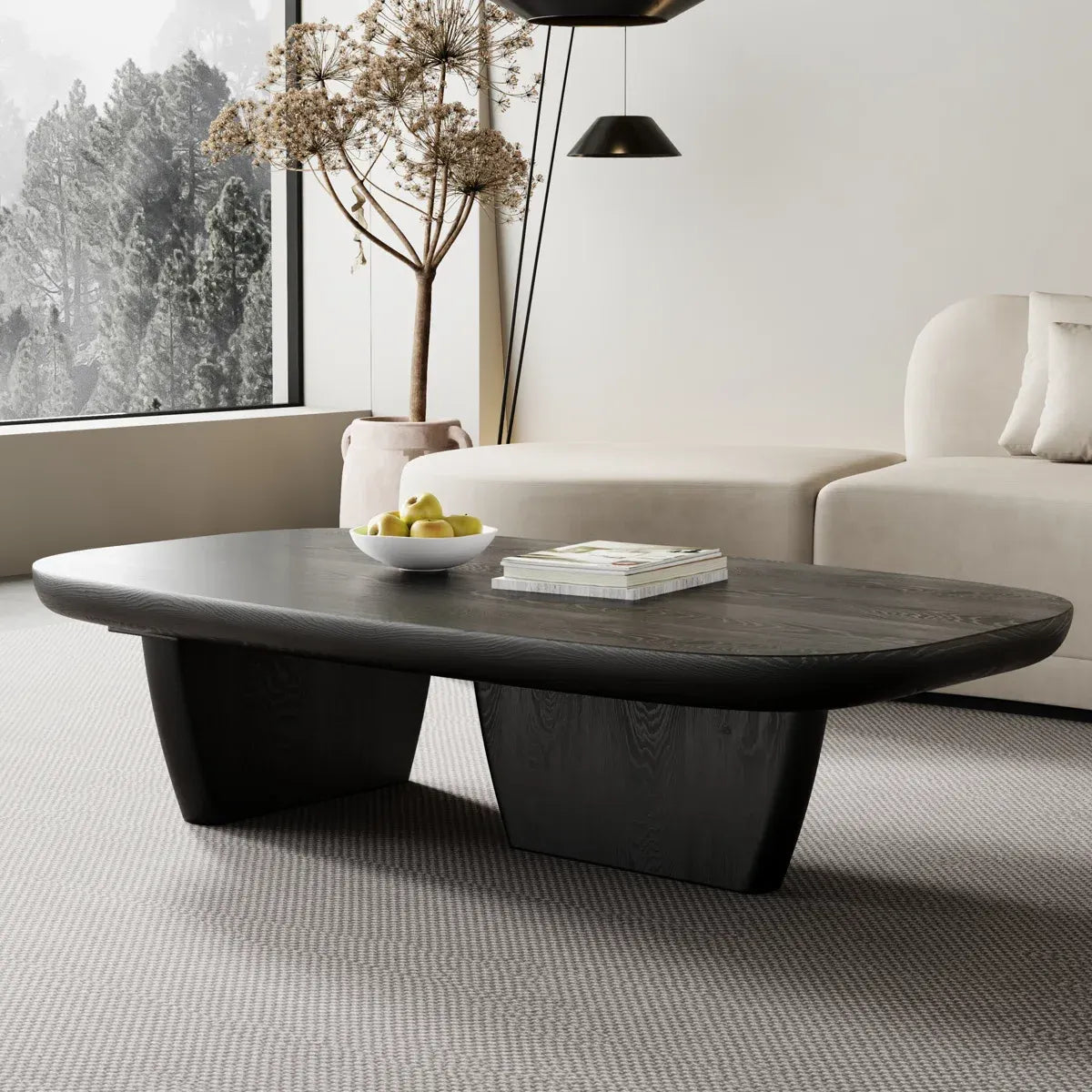 Modern living room with a dark wooden coffee table, white sofa, and decorative elements.