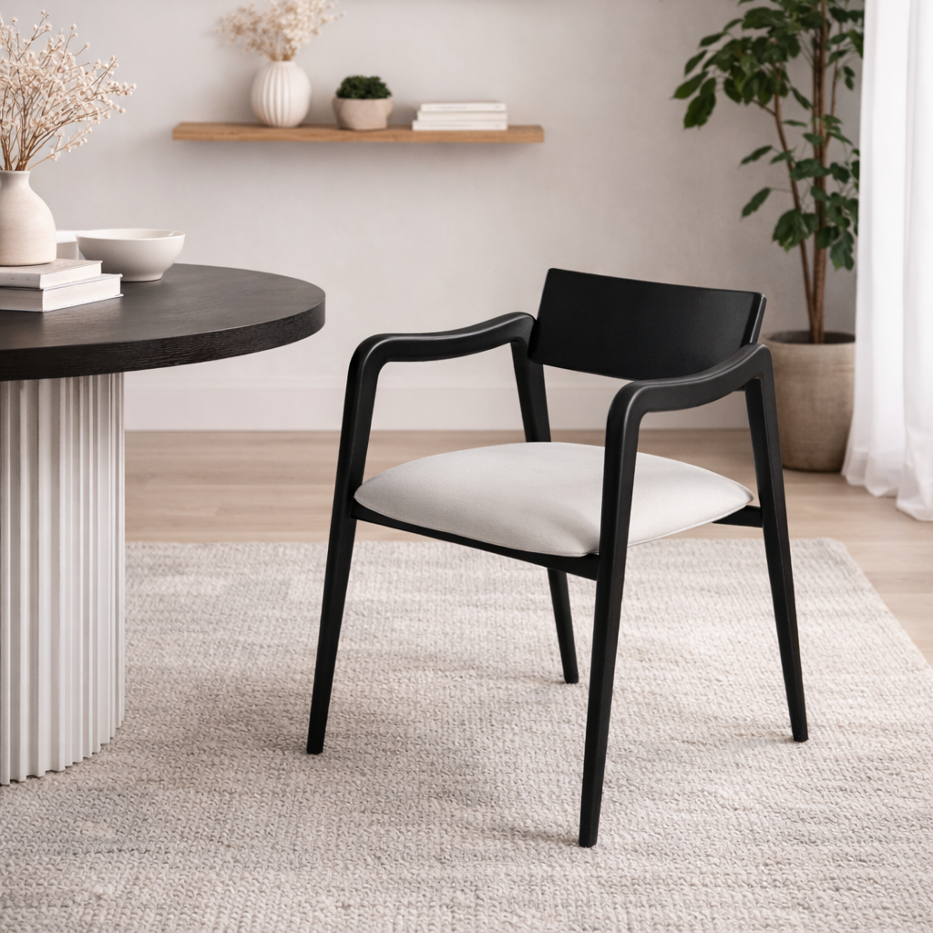 Black chair with white cushion in a modern room setting