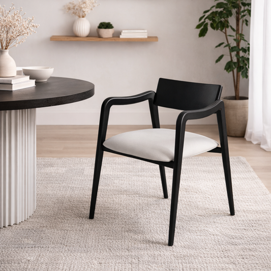 Black chair with white cushion in a modern room setting