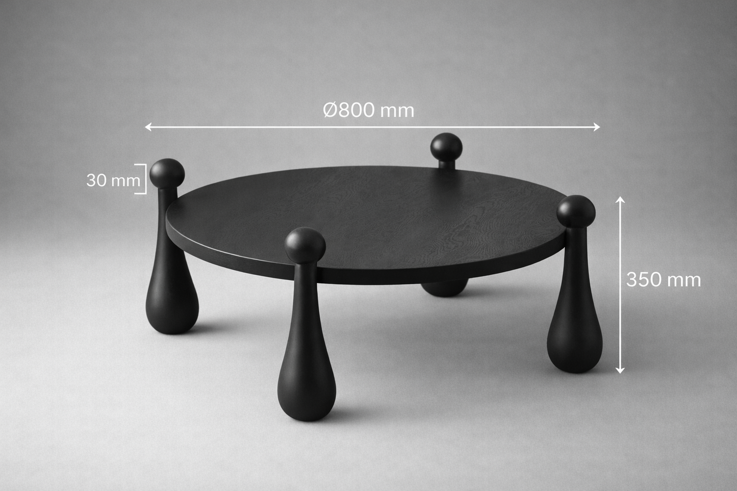 Black round table with measurements on a gray background