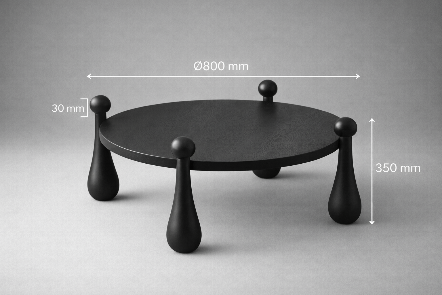 Black round table with measurements on a gray background
