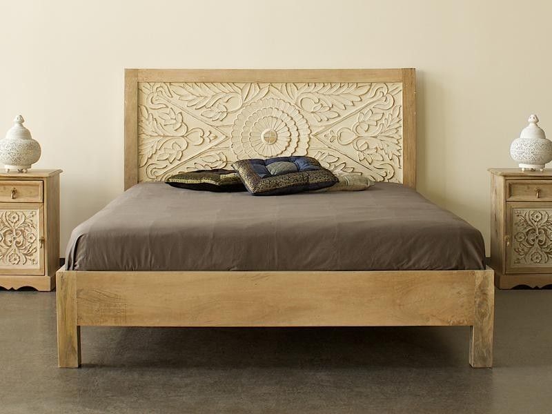 rustic carved wooden bed for warm bedroom styling